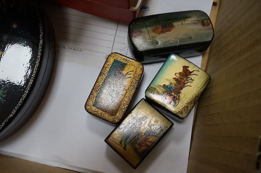 A quantity of mostly 20th century Russian lacquer boxes, a match striker and snuff boxes, some with original receipts. Condition - appears good